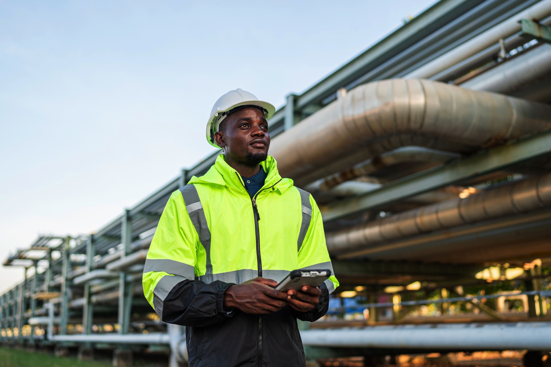 Young mechanical engineer working inspection gas pipeline system new constructio.